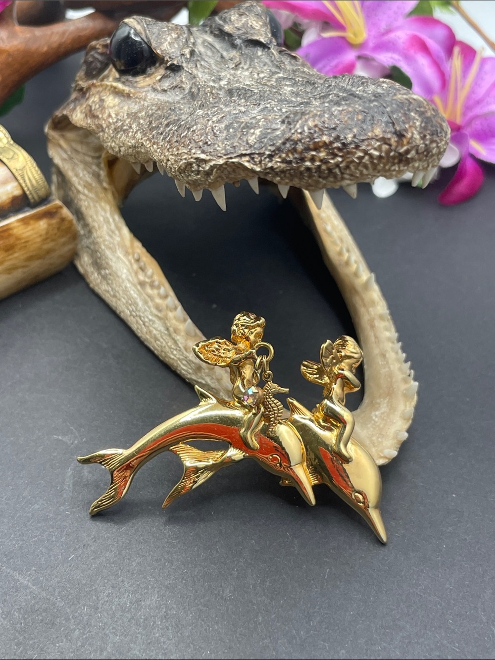 Kirk’s Fully dolphin and cherub brooch vintage